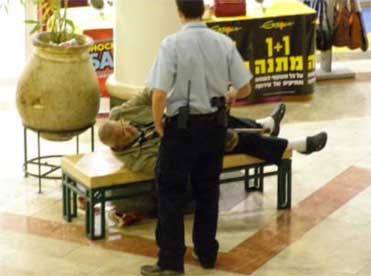 Security approaching old man, Malcha mall